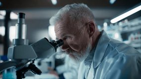 Medical Research and Development Laboratory: Middle Aged Head Scientist Working on Research Project, Looking at a Sample in a Petri Dish Under a Microscope in an Advanced Biotechnology Lab - Powered by Shutterstock - Get 15% off with code: PIKWIZARD15