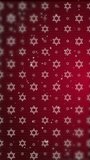 Red background with jewish symbol star of david. Abstract animation with shining rays on hexagonal figures of Judaism. Looped motion graphics. Vertical video.