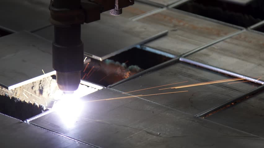 Plasma cutting of metal on a CNC machine. Manufacturing of industrial parts in a computer program. Industrial cutting of metal with a plasma laser at a metal industry plant. Royalty-Free Stock Footage #3481020149