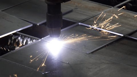 Plasma cutting of metal on a CNC machine. Manufacturing of industrial parts in a computer program. Industrial cutting of metal with a plasma laser at a metal industry plant. ஸ்டாக் வீடியோ