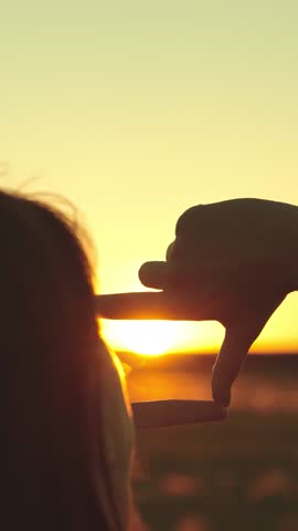happy woman girl hair traveler shows hands gesture frame sunset dream, sunset motivational scene, dream pursuit concept, personal growth vision, life target handframe, motivational scene snapshot