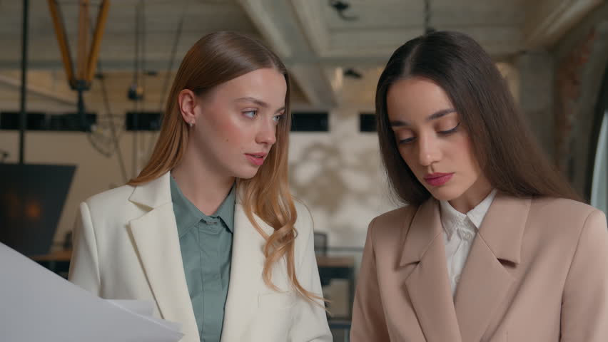 Two business women girls female businesswomen in office ladies managers employers executives feminism team teamwork cooperation arguing with papers conflict problem talking documents disagreement Royalty-Free Stock Footage #3481122551