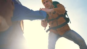 teamwork Silhouette. of tourist assistance help .business travel silhouette concept. couple, group of tourists, happy family lends helping hand in climbing the rocks of mountains. sun two people - Powered by Shutterstock - Get 15% off with code: PIKWIZARD15