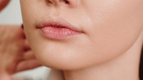 Beauty shot of woman makeup artist applying foundation bb cream on previously applied moisturizing young woman face close-up. Concept of skincare, cosmetics, make up, beauty - Powered by Shutterstock - Get 15% off with code: PIKWIZARD15