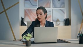 Serious author writing notebook working with inspiration at private cabinet closeup. Focused busy lady writer typing laptop keyboard creating book at office. Formal woman using computer making notes  - Powered by Shutterstock - Get 15% off with code: PIKWIZARD15