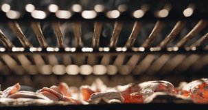 Heated red charcoal exudes aroma of anticipation, carefree summer party. Grill grate is heated and ready for preparing delicious dishes for every taste, ideal for barbecue with friends. Cinematic AD