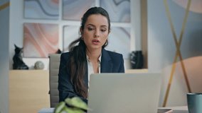 Pensive manager making notes working by modern laptop closeup. Serious businesswoman thinking writing idea in notepad holding mug at office. Thoughtful ceo creating business strategy looking computer  - Powered by Shutterstock - Get 15% off with code: PIKWIZARD15
