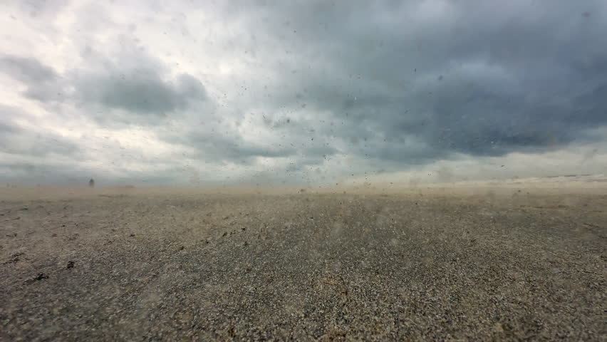  A storm wind carries sand along the sea beach Royalty-Free Stock Footage #3481325897
