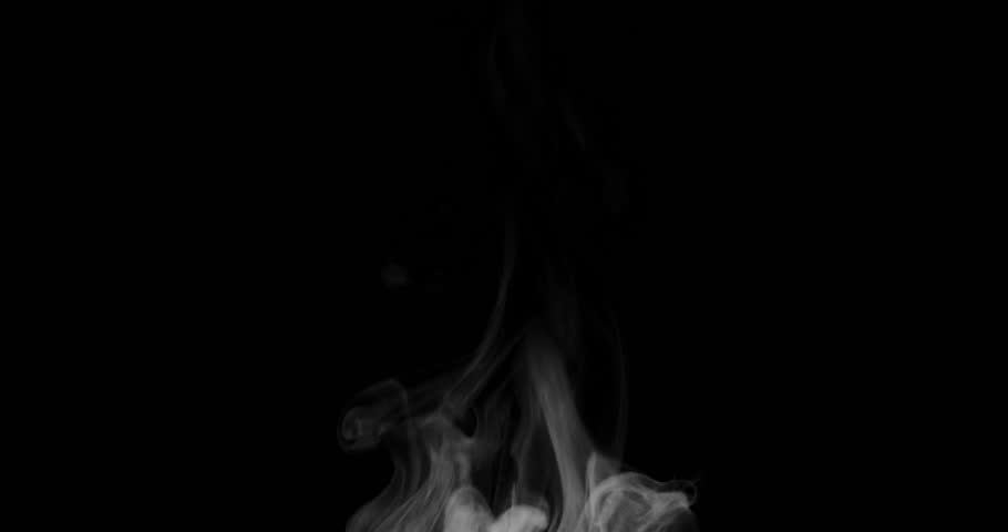Trickle of Steam Slowly Rising from the Cup. White steam rises light, graceful twists on a black background. Slow motion. Footage is perfect for the layer with different blending modes.