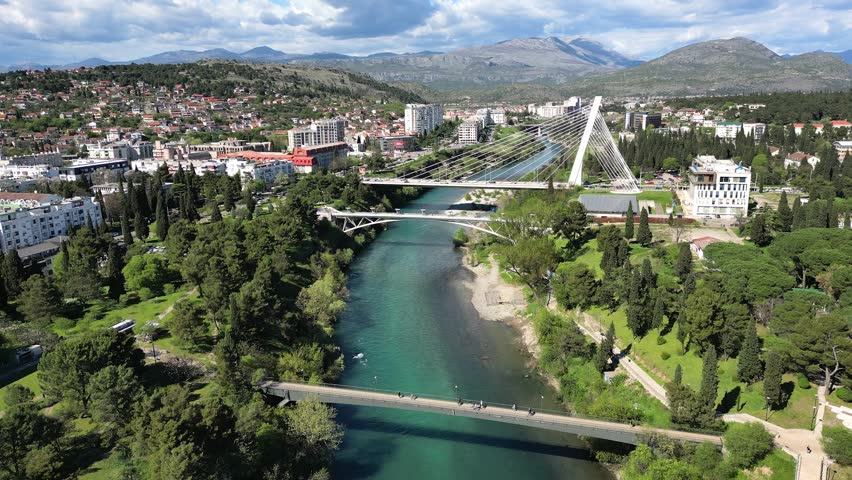Aerial view of the Millennium Bridge and Moraca River in the city center of Podgorica in Montenegro on a sunny day