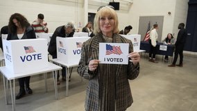 4K: Senior Caucasian Female Voting at Polling Place for the USA Presidential Election. 70-74 years. Holding sign saying 'I voted'. Stock Video Clip Footage - Powered by Shutterstock - Get 15% off with code: PIKWIZARD15