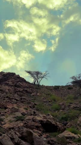 Fiery red sunset sky over mountains. Orange color clouds in sky. Scene of Colorful romantic red sky sunset over mountains. High quality 4k footage