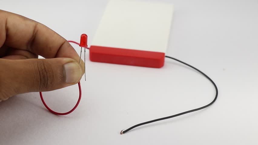 Red color light emitting diode is connected to power source from a battery making the LED glow
