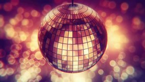 Colorful disco ball loop. Rotating colorful mirror disco ball. Dancing, Glamor, party and celebration concept. Disco Mirror Ball with colorful Background. Disco ball shiny lighting loop.