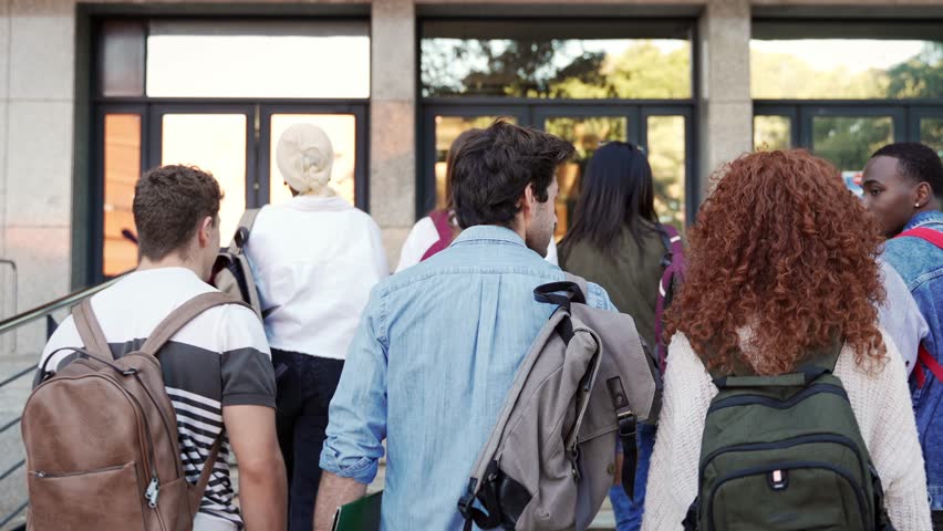  Group of students walking arriving to University to start classes - Powered by Shutterstock - Get 15% off with code: PIKWIZARD15