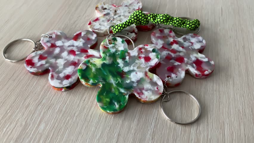 products made from recycled plastic. plastic keychain. recycled materials.recycled products.slow motion video. High-quality shooting in 4K