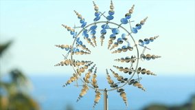 Kinetic wind sculpture, moving fashion garden decoration, art design. Weather vane. Roundabout. Slow motion - Powered by Shutterstock - Get 15% off with code: PIKWIZARD15