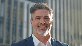 Handsome hispanic senior business man smile at camera. Headshot close up portrait of indian or latin confident mature good looking middle age leader, ceo male businessman in suit on office background. - Powered by Shutterstock - Get 15% off with code: PIKWIZARD15