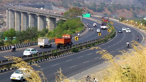 Cars trucks bikes on Indian highway tallest bridge - Mumbai Pune Bangalore Highway 