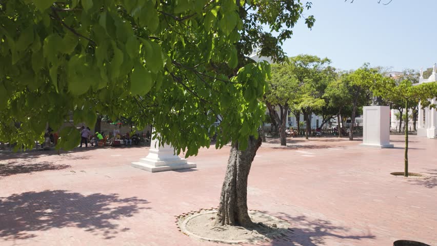 Slow establishing shot of the Parque de los Novios in Santa Marta at summer