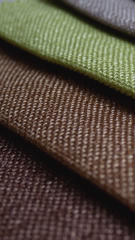 Colorful fabric cloth texture for background. Fashion designer at tailor works studio concept. Any textile formed by weaving. Different colors. Clothes texture closeup
