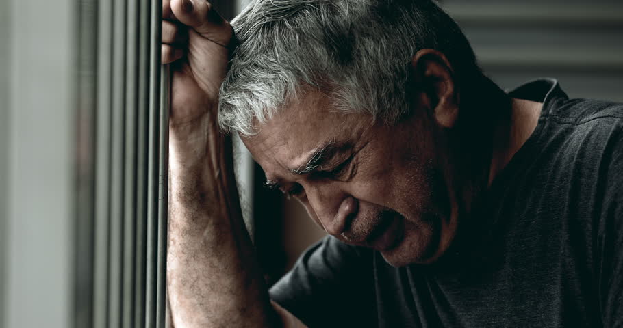Elderly Man in His 70s, Tearful and in Despair, Close-Up Portrait of His Struggle with Depression and Emotional Scars, Clutching a Metal Bar as He Faces Past Shame and Regrets