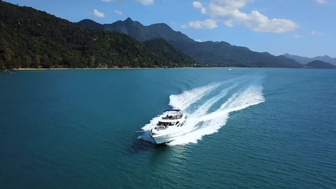 luxury boat aerial view, luxurious yacht moving fast in blue sea