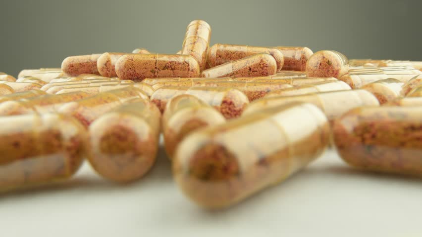 Turmeric and curcumin in clear capsules for natural support. Dietary supplements in capsules: health in every dose. Treatment and prevention in medicine and pharmacology. Production drug preparations