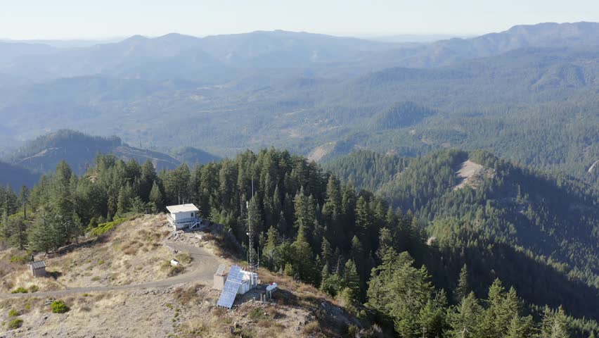 Fire lookout in the southern Oregon Cascades overlooking the valleys from the mountain top