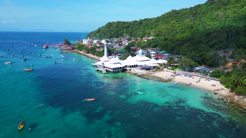 Islamic white mosque at beach on Perhentian Island. Magic aerial top view flight overflight flyover drone
4k