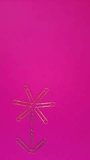 Paper clips stop motion. Metal paper clips appear on a pink background in the shape of a flower. Vertical  animation