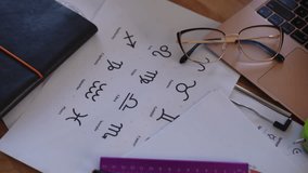 Close-up. A table with astrological accessories and a laptop in the office of a modern astrologer - Powered by Shutterstock - Get 15% off with code: PIKWIZARD15