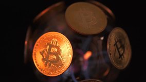 Glow gold digital crypto coins BTC Bitcoin on electric sphere rotating on black background. Crypto currency, big data and block chain. - Powered by Shutterstock - Get 15% off with code: PIKWIZARD15