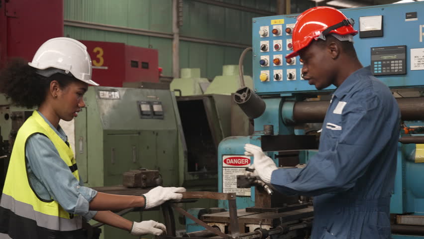 Blue collar workers work at metal factory. Blue collar worker and engineering.