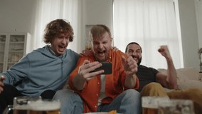 Sport fans cheering for favorite team, watching match on smartphone and talking phone. World Sport games USA, Canada, Mexico. North America Football Cup, Football, sports and soccer fans. Slow Motion - Powered by Shutterstock - Get 15% off with code: PIKWIZARD15