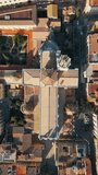 religious christianity cross shape cathedral and cozy streets with ancient architecture of coastal town Tarragona, Spain, aerial drone view 4k
