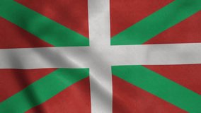 The Basque Country flag waving. Spanish autonomous community. White cross over green saltire on a red field