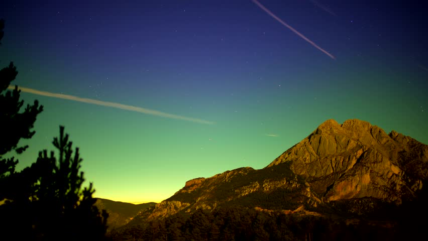 This is amazing seen of the 
mountain during a sunset and stars in the sky. Royalty-Free Stock Footage #3482543617