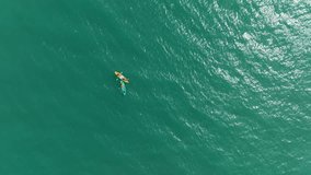 Aerial view of People kayaking in the sea, 4k video