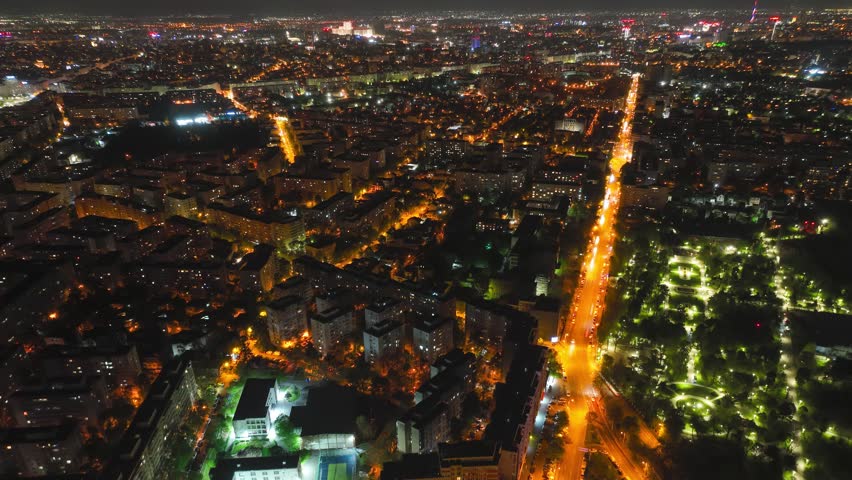 Aerial hyperlapse over Bulevardul Lacul Tei at night in Bucharest, Romania