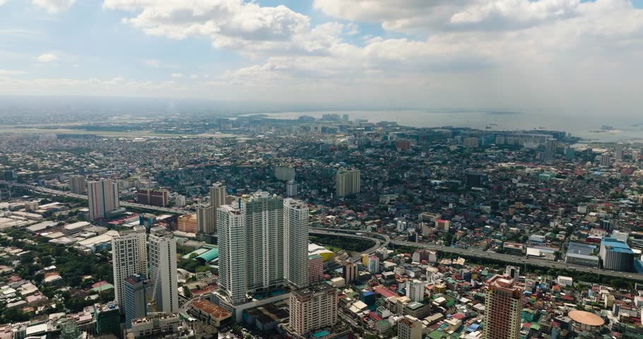 Metro Manila Cityscape: Modern Buildings and Skyway. Coastal City in Philippines.