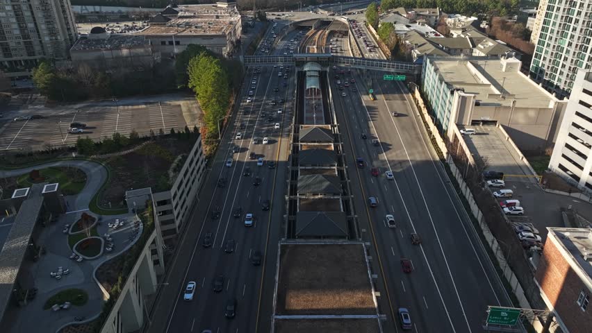 Flying Over Buckhead Subway Station To Pedestrian Bridge In Atlanta, Georgia, USA. - aerial shot
