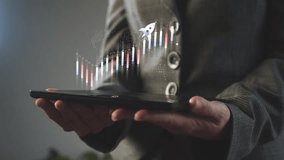 Sustainable financial growth is characterized by a flying rocket above the chart and Chinese candlesticks above the tablet in the hands of a businesswoman. Cg - Powered by Shutterstock - Get 15% off with code: PIKWIZARD15