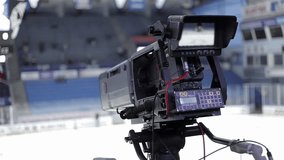 a camera for broadcasting sports events. video equipment at a hockey match. sports journalist's Day. television of a sports event
