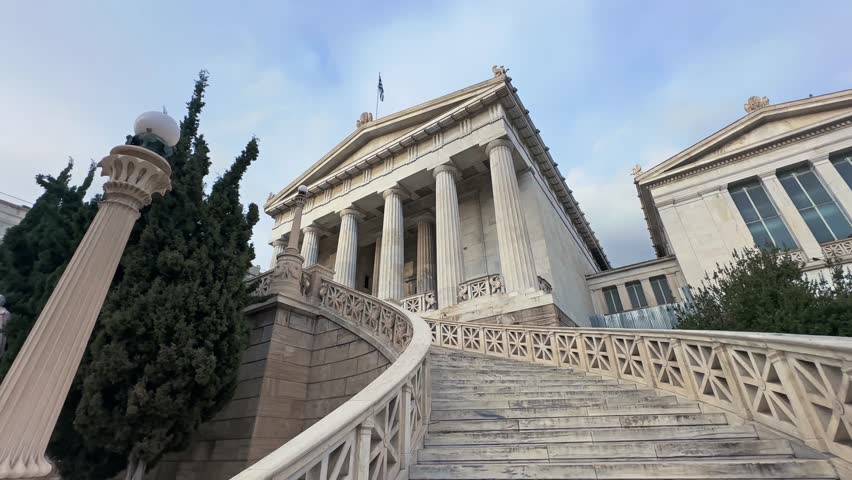 National library in the center of Athens Greece. One of the Trilogy of neoclassical buildings including the Academy of Athens and the original building of the Athens University in Panepistimiou street Royalty-Free Stock Footage #3482675397