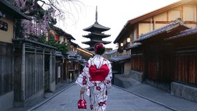 Asian woman wearing japanese traditional kimono at Yasaka Pagoda and Sannen Zaka Street in Kyoto, Japan. - Powered by Shutterstock - Get 15% off with code: PIKWIZARD15