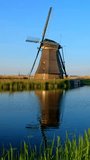 Windmills at famous tourist site Kinderdijk in Holland on sunset. Kinderdijk , Netherlands