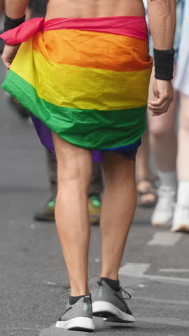 People enjoy lgbt pride parade. Same sex love concept. Dressed up bi man wear rainbow flag. Joy free gay go walk city street. Happy csd lgbtq fest. Fun coming out party. Queer culture festival month.