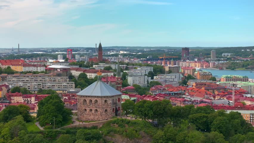 Scenic aerial view of the Old Town with Oscar Fredrik Church in the gorgeous sunset, Gothenburg, Sweden. rooftops panoramic view, Klippan port in Gothenburg harbor in afternoon, Famous bridge 