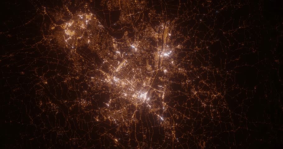 Albany (New York, USA) aerial view at night. View on modern city from space. Camera is zooming in, rotating counterclockwise